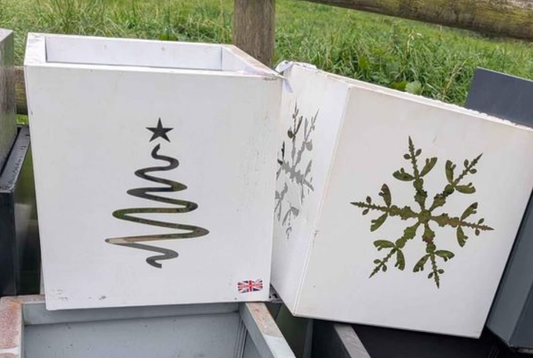 2 x metal tree planters including Christmas themed